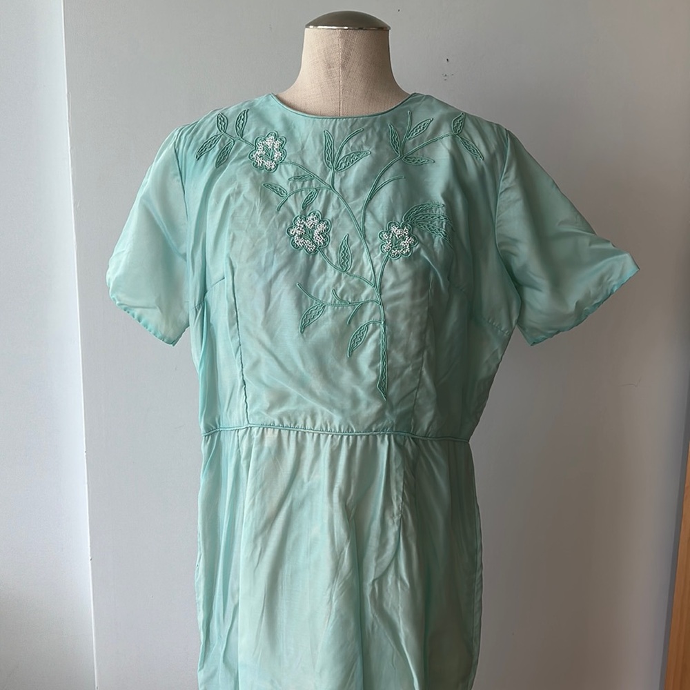 vintage blue wiggle dress with floral chest detail